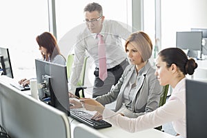 Business people working on computer in office