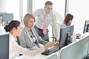 Business people working on computer in office