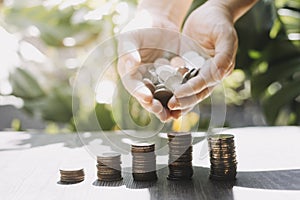 business people working at desk with piggy bank box.business finance saving and investment concept. hand put money coin into piggy