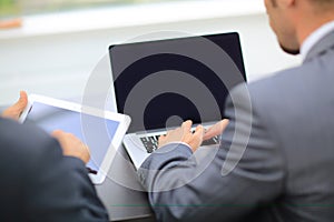 Business people working with digital tablet and laptop