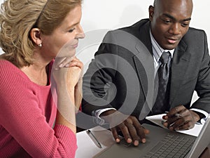 Business People Working On Laptop At Table