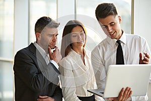 Business People working on a laptop. Team work