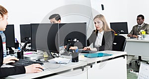 Business people working in modern open plan office