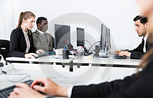 Business people working in modern open plan office