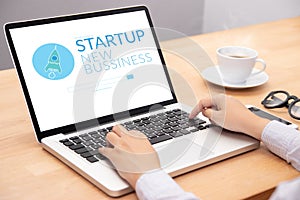 Business people working on notebook laptop computer with startup business and rocket logo on screen, start up ideas business