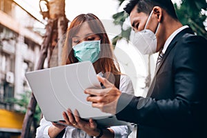 Business People Working at Outdoor Location ,They `re Wearing Protective Mask to Prevent Flu and Corona Virus Covid-19 Outbreak