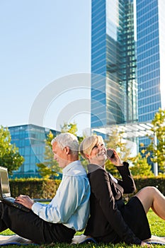 Business people working outdoors