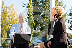 Business people working outdoors