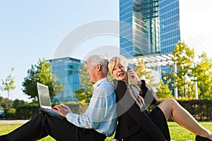 Business people working outdoors