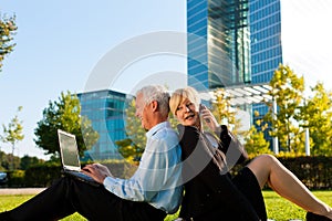 Business people working outdoors