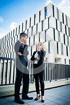 Business people working outdoors in city