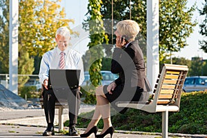 Business people working outdoors