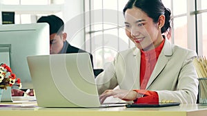 Business people working at table in modern office