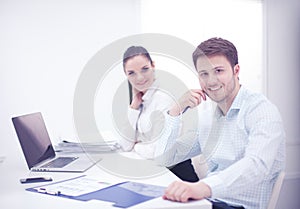 Business people working together at desk, white background