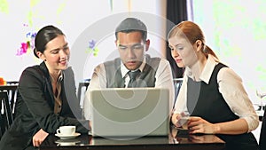 Business people working together while having coffee in a restaurant