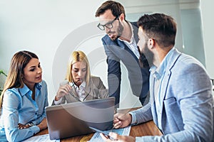 Business people working together on project in office