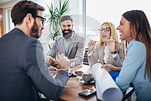 Business people working together on project in office