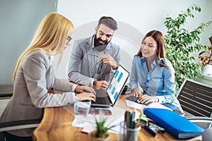 Business people working together on project in office