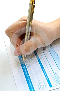 Business people writing the pen on deposit slip