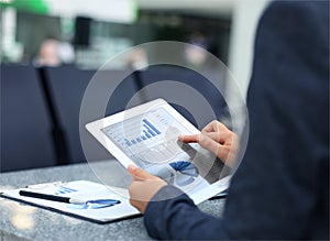 Business person analyzing financial statistics