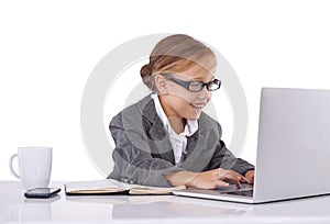 Business person, child and typing on laptop in studio, email and report or proposal on white background. Female person
