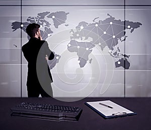 Business person drawing dots on world map