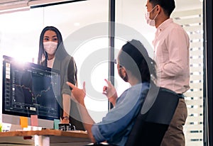 Business person with face mask discuss work after office reopen