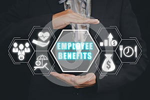 Business person hand holding Employee Benefits icon on virtual screen