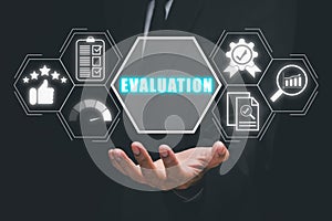 Business person hand holding evaluation icon on virtual screen