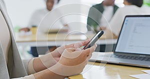 Business person, hands and phone typing for research, social media or networking at office desk. Closeup of employee on