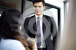 Business person handshake in meeting room for business partner