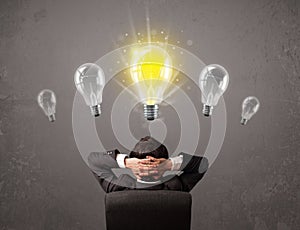 Business person having an idea light bulb concept