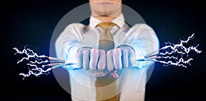 Business person holding electrical powered wires