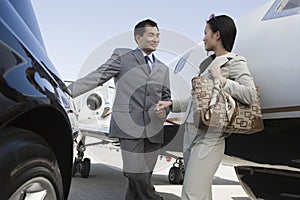 Business Person Holding Hands At Airfield photo