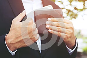 Business Person holding an wallet in the hands of an man no money