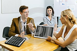 Business person meeting on solar cell panel technology. Business People Discussing Solar Power Environment Concept