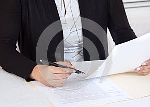 Business person reading financial documents