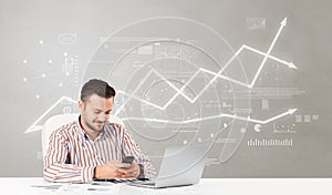 Business person sitting at desk with financial change concept