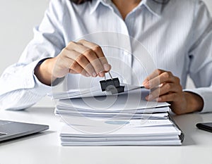 Business Person Stamping Documents in Office Setting