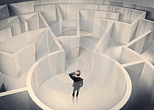 Business person standing in maze center