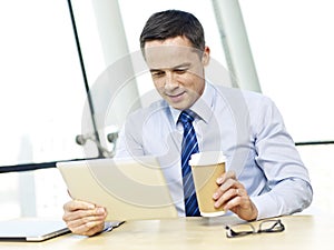 Business person using tablet in office