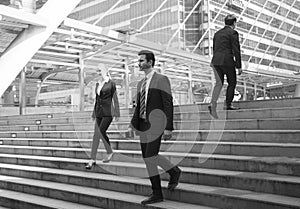 Business person walking on stairs. rush hour concept