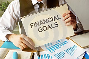 Business photo shows hand written text Financial Goals