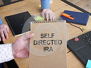 Business photo shows hand written text self directed ira