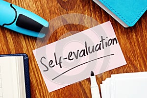 Business photo shows hand written text Self-evaluation photo
