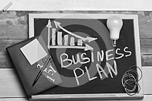 Business plan concept. Blackboard with business chart