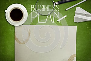 Business plan concept on green blackboard with
