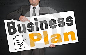 Business plan poster is held by businessman