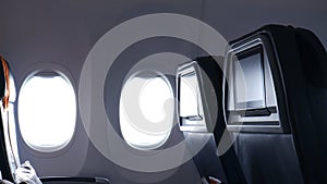 Business plane interior with windows. Background of airplane seats and windows