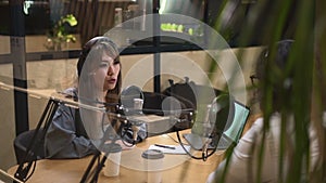 Business podcast in studio Asian woman talks to guest Spbd